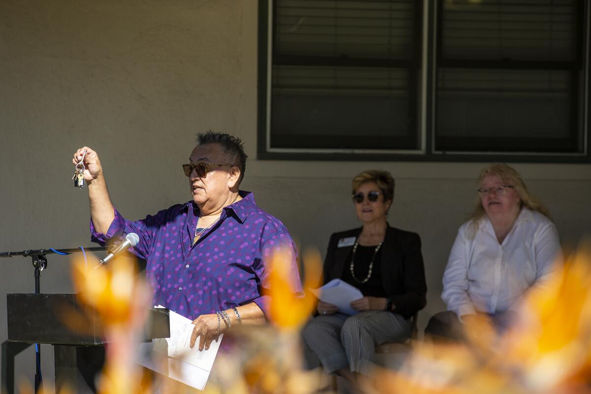 Randy Pesqueira, the director of the Senior Center in Central Park, speaks during Friday's ceremony.