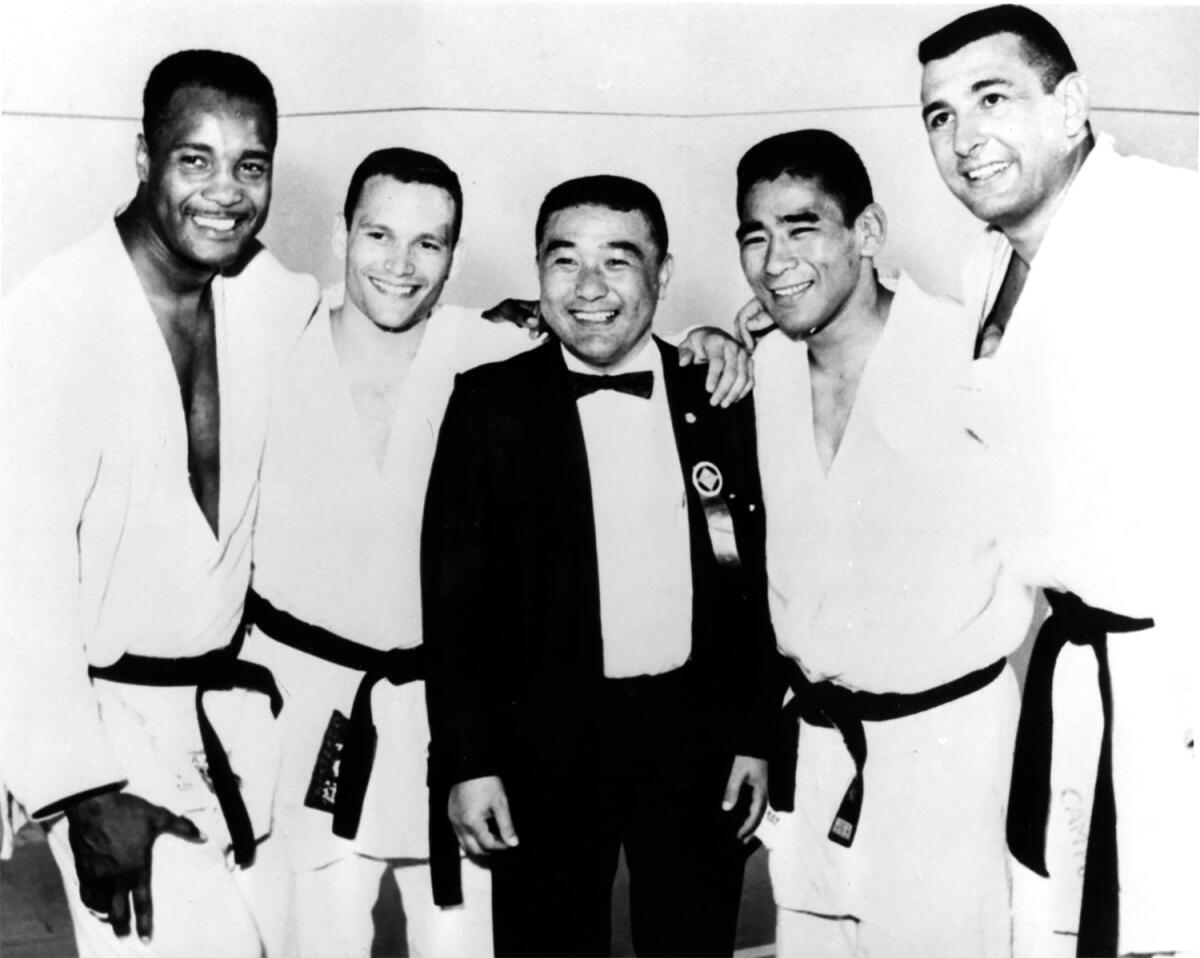 Yosh Uchida with U.S. judo Olympians in 1964.
