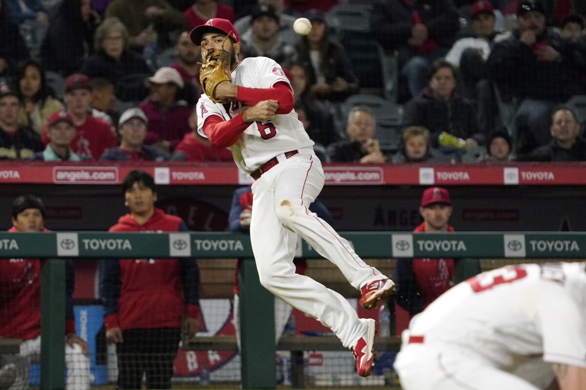 Angels third baseman Anthony Rendon attempts to throw out Baltimore Orioles' Austin Hays