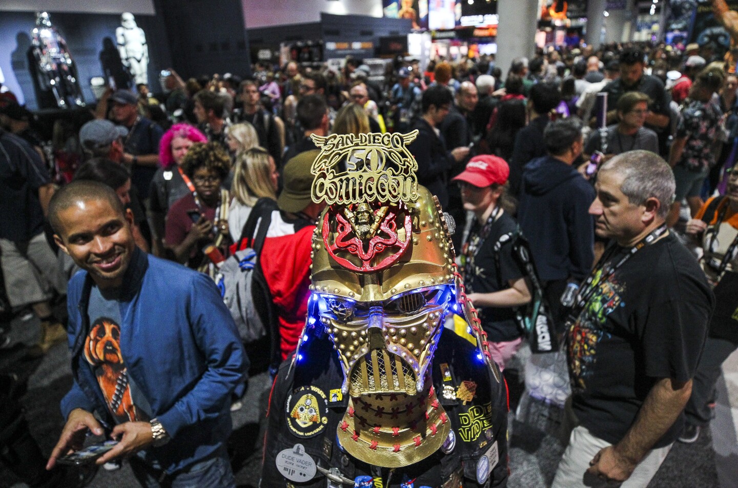 Christopher Canole, from La Jolla, wears his Dudevader headgear, which commemorates 50 years of Comic-Con in San Diego during Comic-Con International's Preview Night at the San Diego Convention Center on Wednesday, July 17, 2019 in San Diego, California.