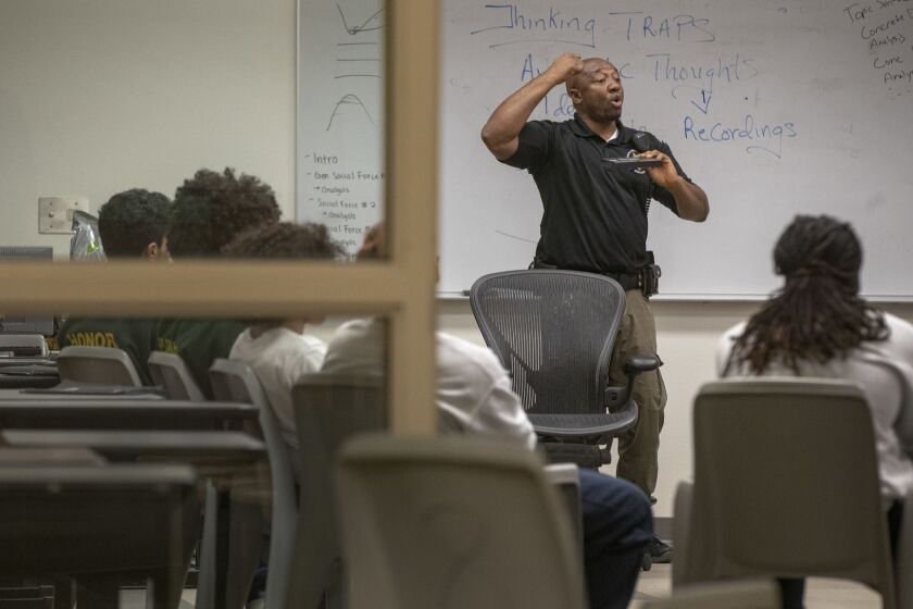 SACRAMENTO, CALIF. -- THURSDAY, JANUARY 31, 2019: Probation officer William Agborsangaya, or 'Mr. A' as he is known to staff and residents, conducts a leadership program at the Sacramento County Youth Detention Facility in Sacramento, Calif., on Jan. 31, 2019. (Brian van der Brug / Los Angeles Times)