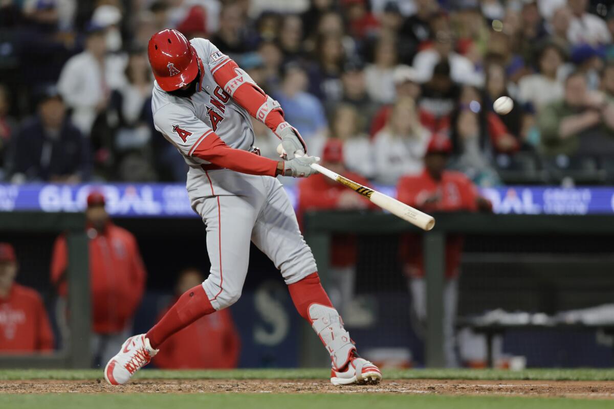 Jo Adell hits a grand slam for the Angels during the seventh inning of a 5-4 loss to the Seattle Mariners at T-Mobile Park.