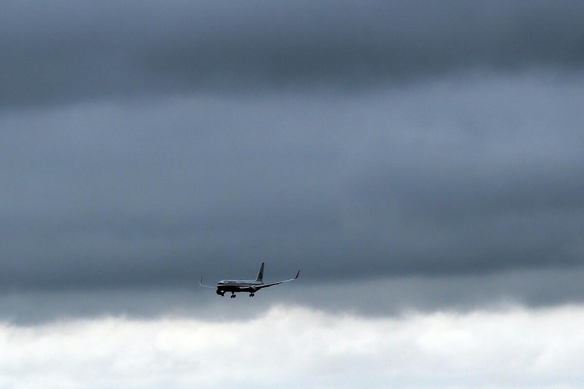 A plane arrives at New York's John F. Kennedy Airport on Saturday, the first day of enhanced screening of travelers arriving from West African countries that have been affected by Ebola.