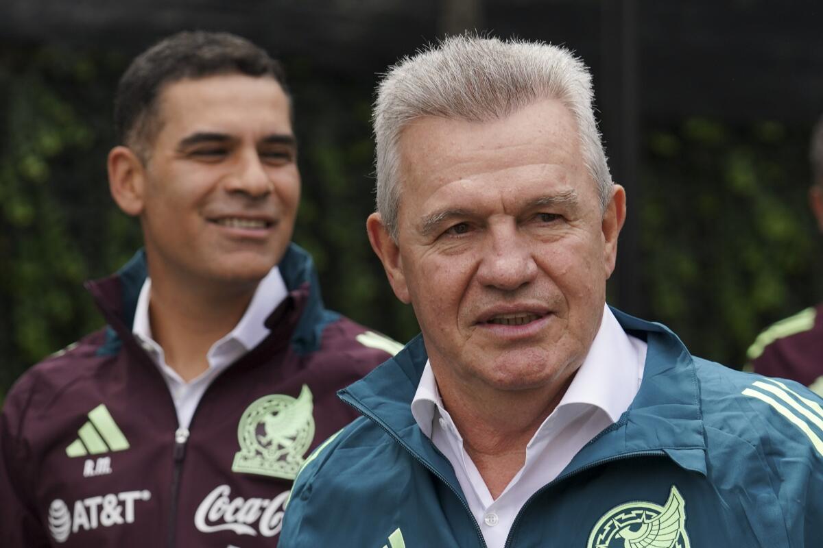 Mexico coach Javier Aguirre, right, and his assistant, former Mexico standout Rafael Márquez, attend a news conference.