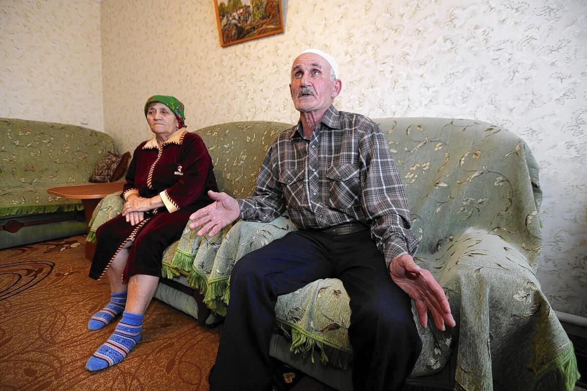 Crimean Tatars Jafer Abdulkerimov and his wife, Sheide, survived the 1944 deportation of Tatars under Stalin. The presence of Russian troops in Crimea is recalling memories from that dark era, they say.