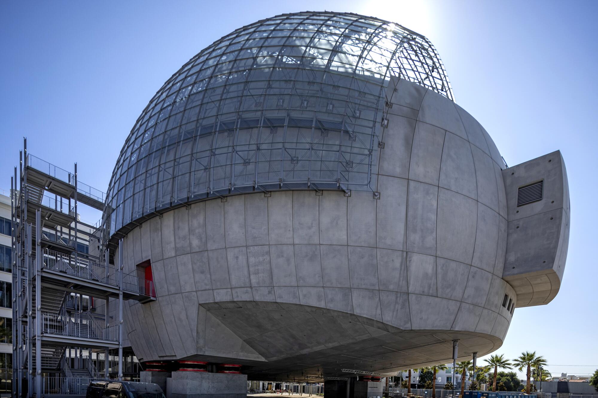 A view of the spherical David Geffen Theater from below shows the building hovering over four plinths.