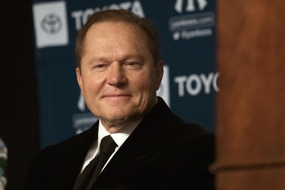 Sports agent Scott Boras listens as Gerrit Cole is introduced as the newest New York Yankees player.