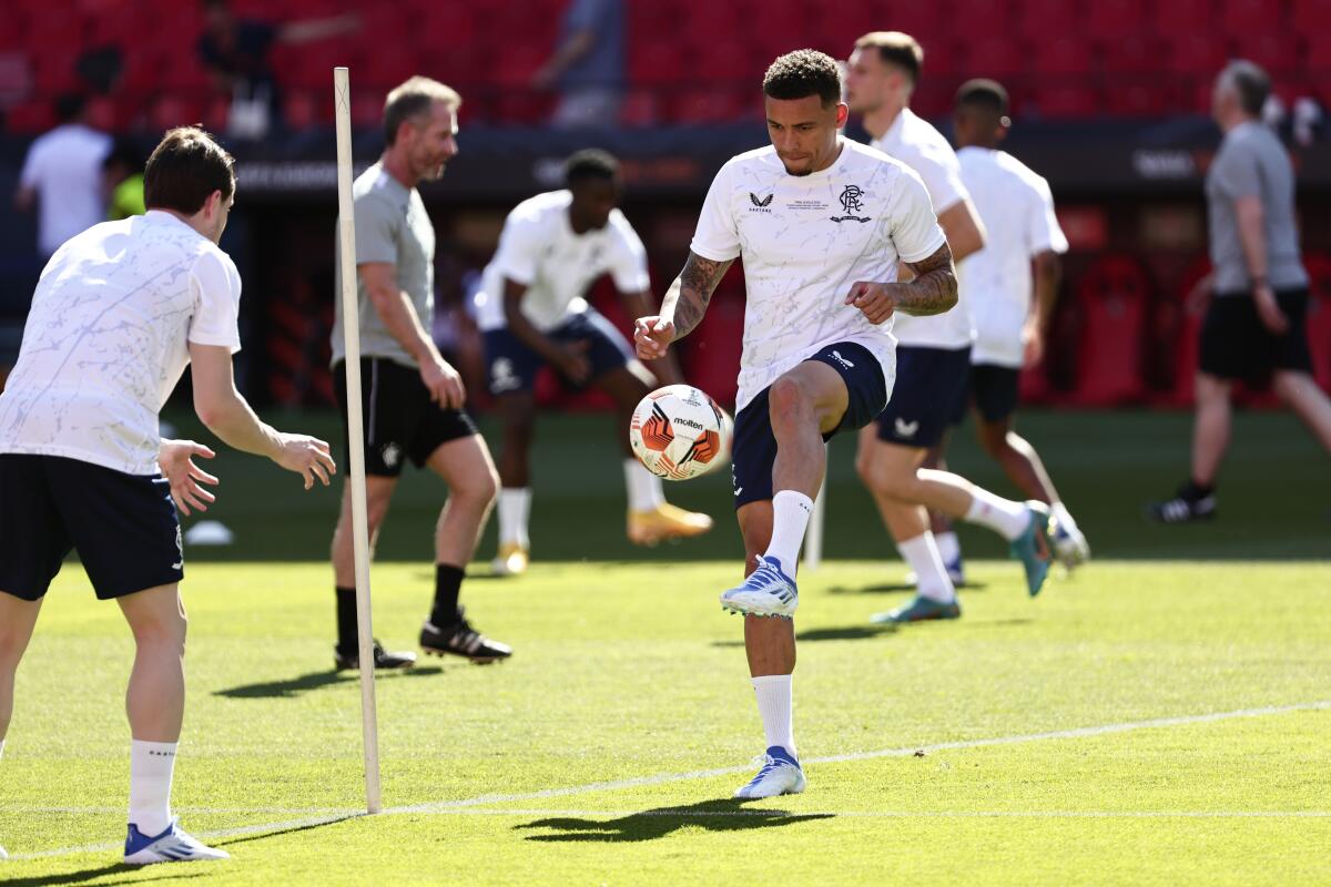 Rangers' James Tavernier controls the ball during a training session at the Ramon Sanchez-Pizjuan Stadium in Seville, Spain, Tuesday, May 17, 2022. Eintracht Frankfurt and Glasgow Rangers are holding stadium training sessions ahead of the Europa League final on Wednesday in Seville.(AP Photo/Pablo Garcia)