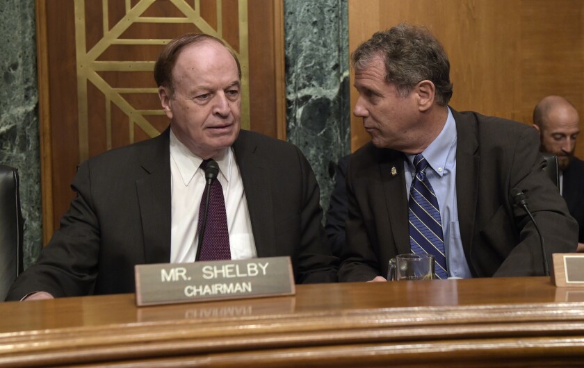 Sen. Sherrod Brown (D-Ohio), right, talks with Senate Banking, Housing and Urban Affairs Committee Chairman Richard Shelby (R-Ala.) before the start of the panel's Sept. 20 hearing on Wells Fargo's fake-accounts scandal.