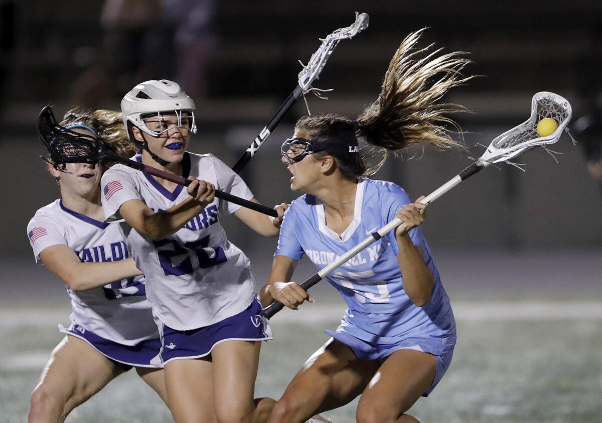 Corona del Mar's Frankie Garcia (15) stops to take a shot during Battle of the Bay game against Newport Harbor.