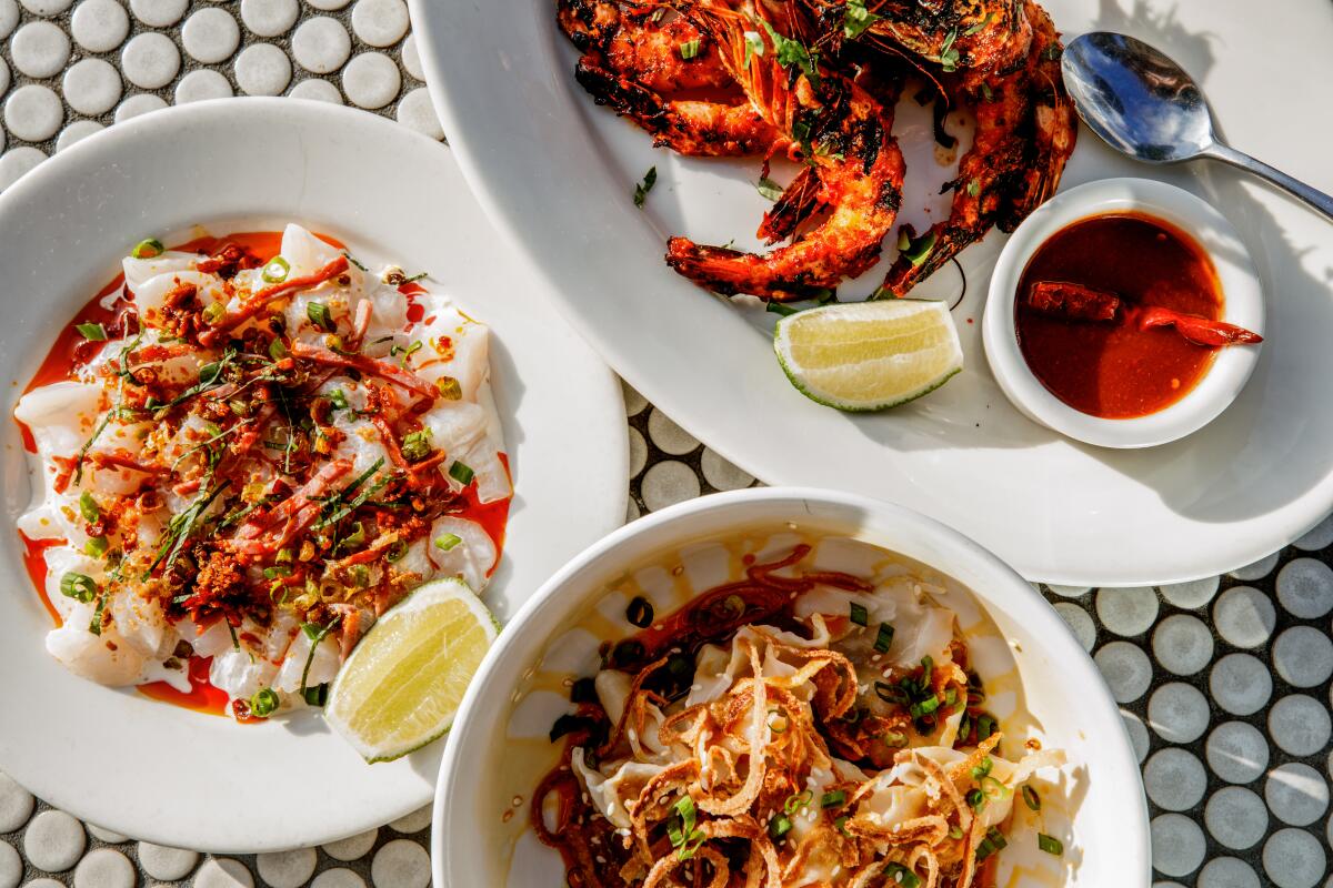 SANTA MONICA, CA - OCTOBER 4: Clockwise from left: raw spicy scallops, sunbathing prawns and spicy wontons from Cassia on Tuesday, Oct. 4 in Los Angeles, CA. (Annie Noelker / For The Times)