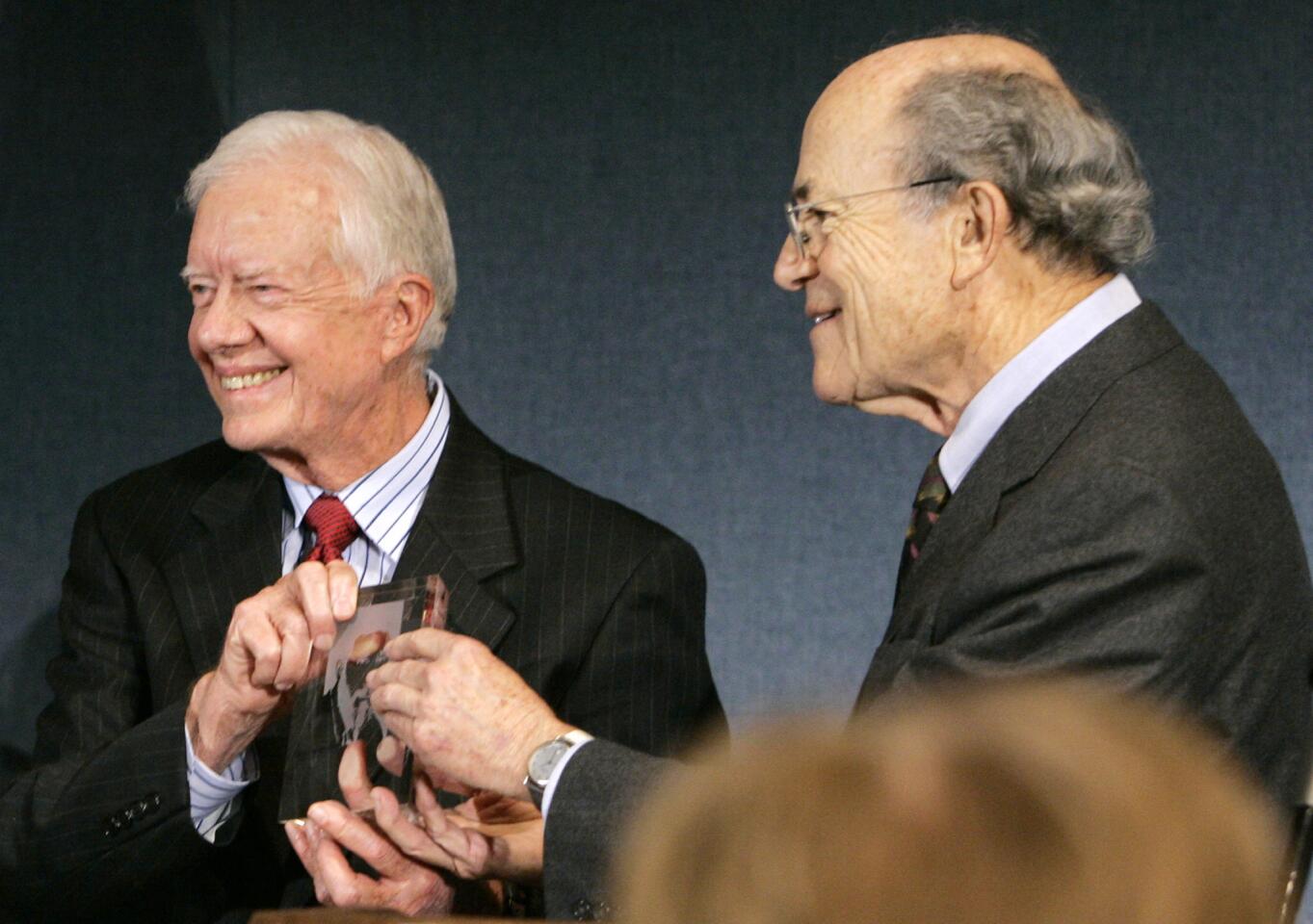 Former President Jimmy Carter, left, receives the Ridenhour Courage Prize from Rabbi Leonard Beerman in 2007 in Washington. Beerman was the founding rabbi at Leo Baeck Temple in L.A., serving from 1949 to 1986.