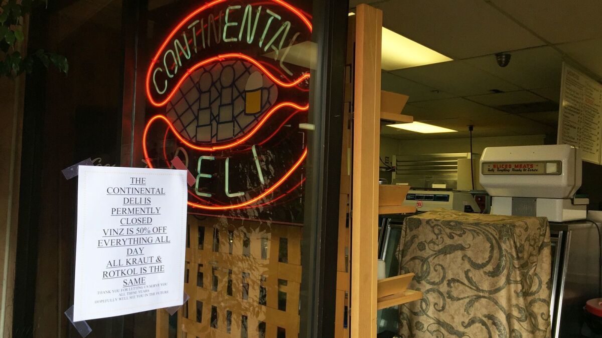 A sign on the door ar Continental Delicatessen in Escondido, which closed Saturday after 52 years in business, thanks customers for their support. Facing eviction, owners Vinnie and Michelle Griffin closed the deli on Saturday and nearby Vinz Wine Bar's last day was on Monday.