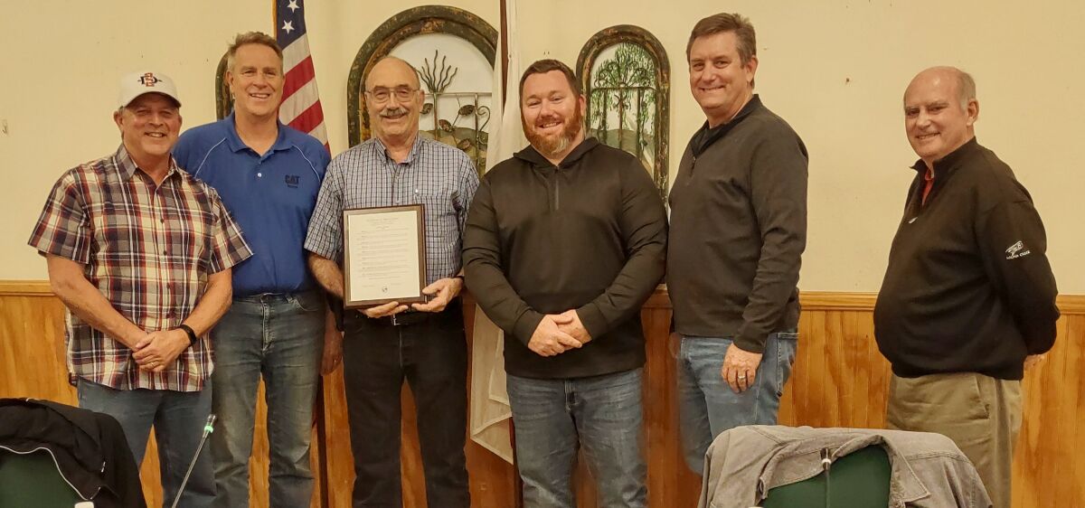 Water District Meter Services Supervisor Tim Warner, center, was honored for 23 years of exemplary service to the district. 