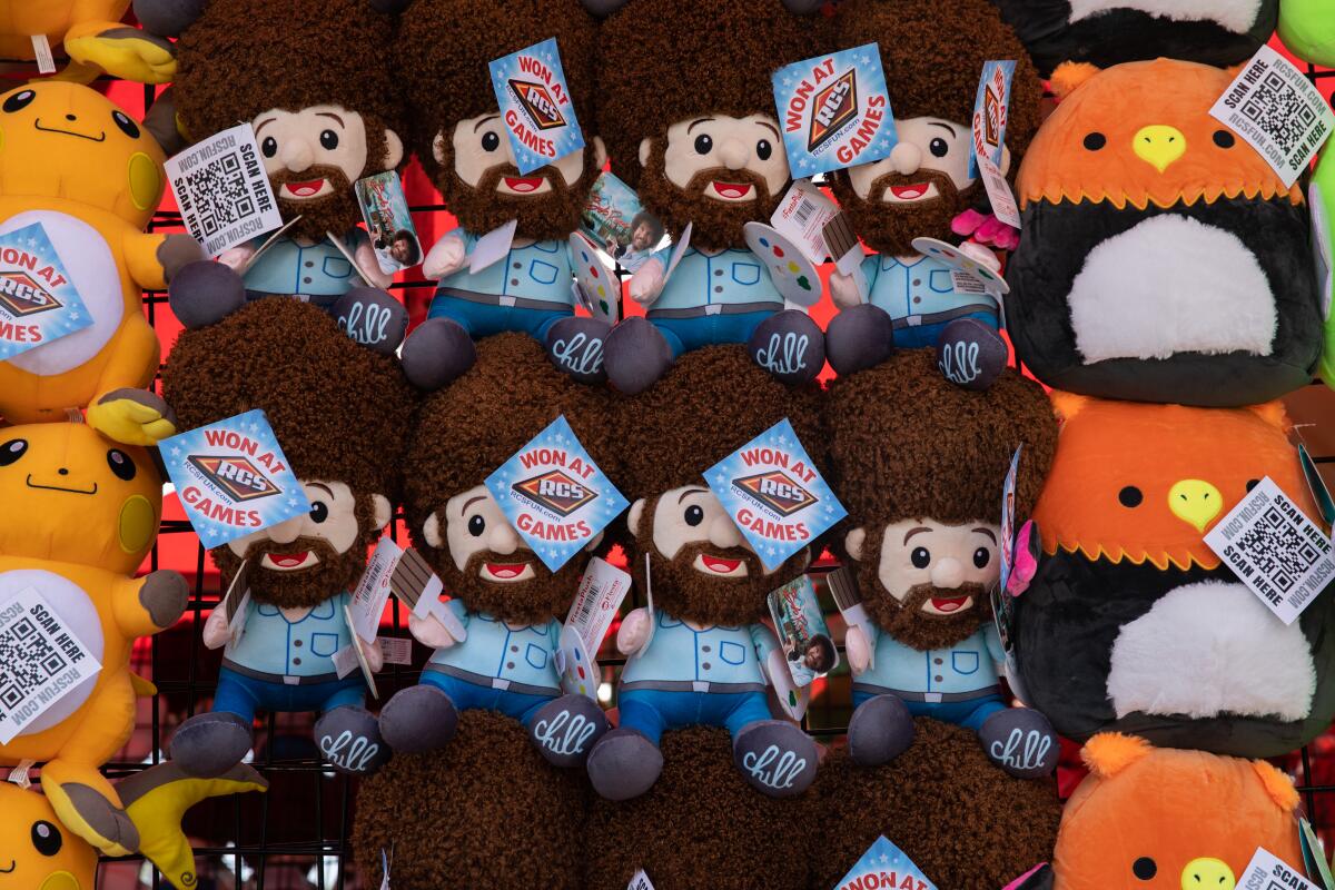 Dolls of American Painter Bob Ross are among many of the prizes at the San Diego County Fair.