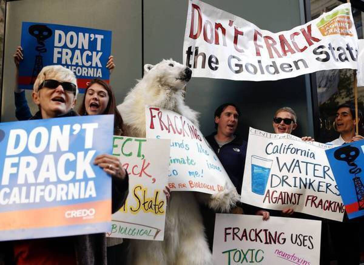 Demonstrators in San Francisco earlier this month protest California Gov. Jerry Brown's position on fracking. Most environmental groups wanted Brown to veto a fracking bill he signed Friday, saying it did not go far enough to protect the environment.
