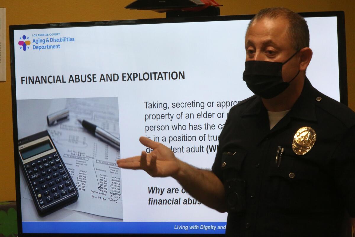 LAPD Senior Lead Officer Carlos Diaz gives a presentation about financial scams and physical abuse