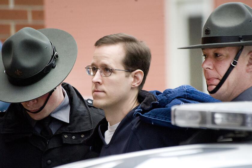 Eric Frein is escorted to a preliminary hearing on Jan. 5 at the Pike County Courthouse in Milford, Pa.