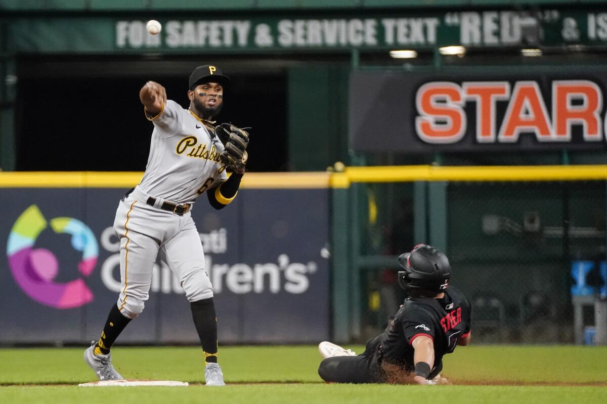 Photos: Reds, Pirates scuffle in the fourth inning on Sunday