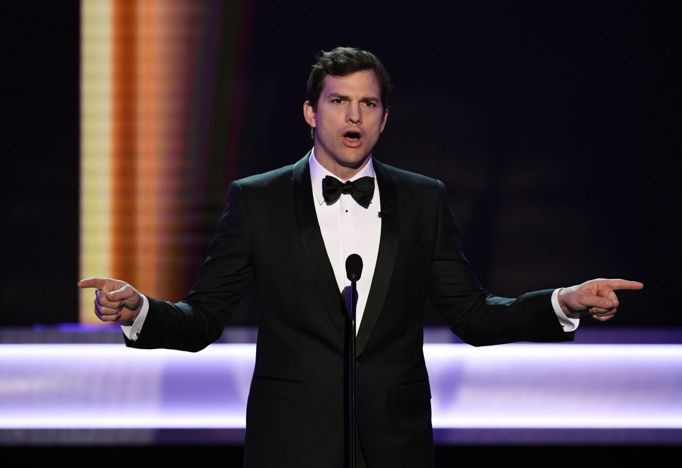 Ashton Kutcher speaks onstage during the 23rd Screen Actors Guild Awards at the Shrine Auditorium.