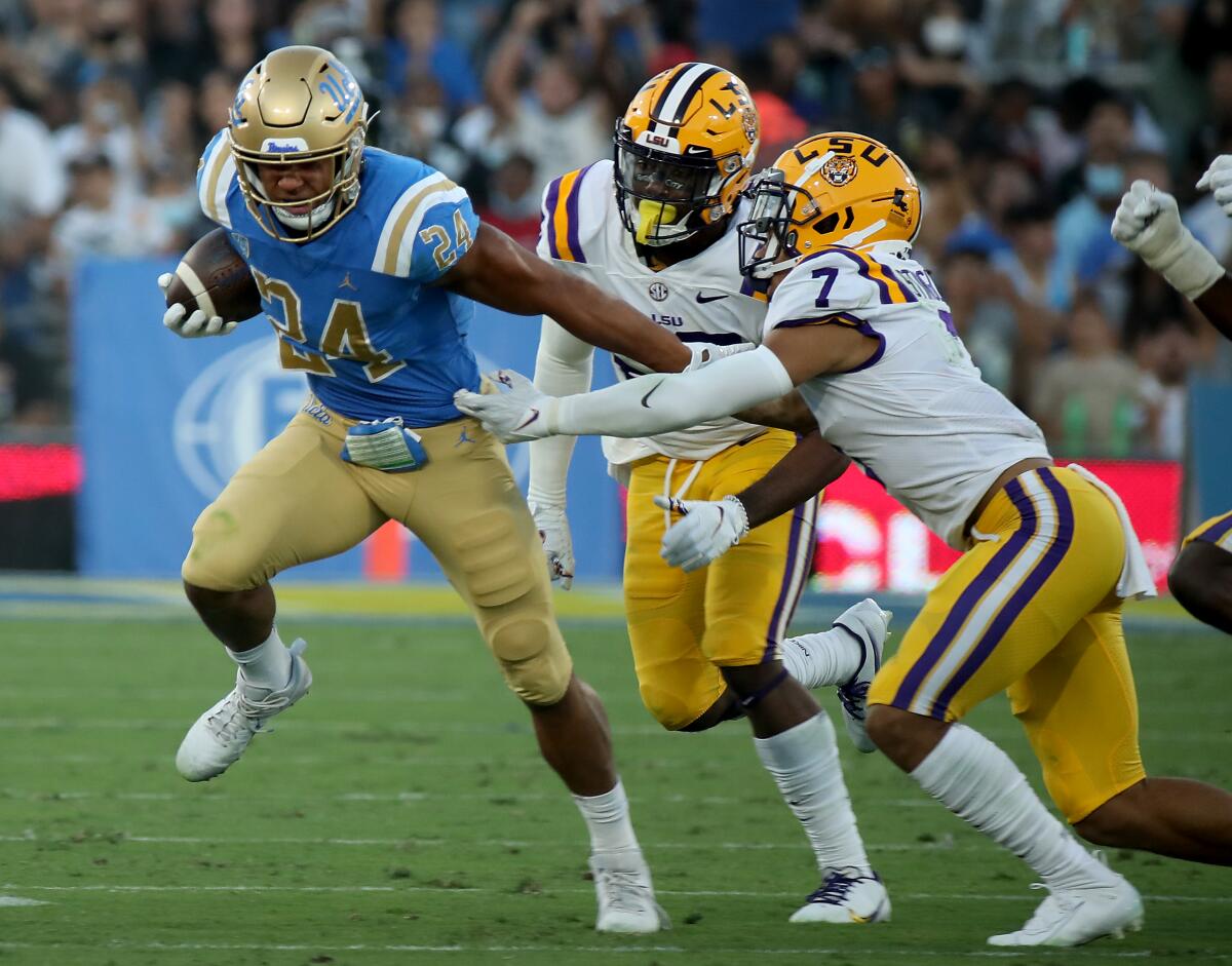 UCLA running back Zach Charbonnet powers upfield against LSU.