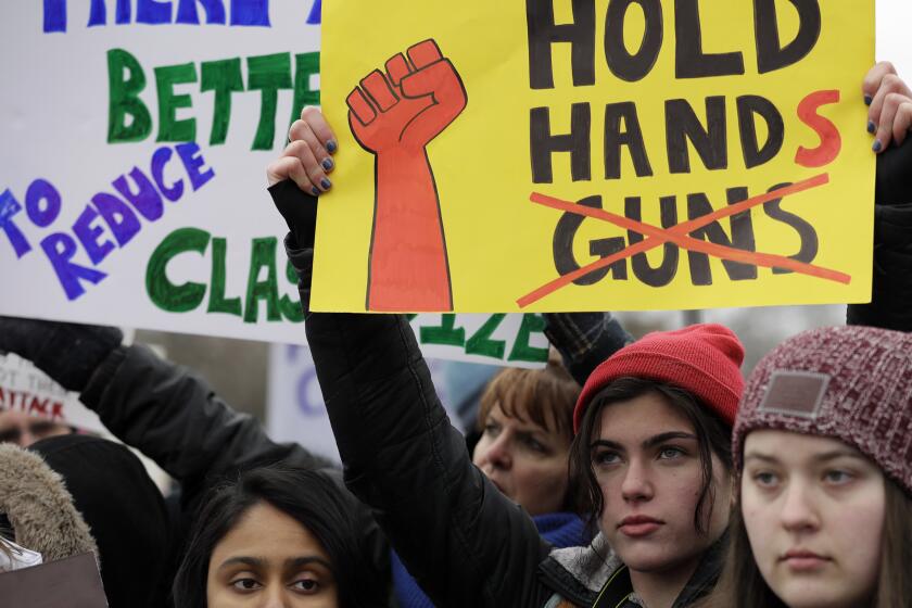 Demonstrators attend a "March for Our Lives" rally in support of gun control, Saturday, March 24, 2018, in Chicago. Students and activists across the country planned events Saturday in conjunction with a Washington march spearheaded by teens from Marjory Stoneman Douglas High School in Parkland, Fla., where over a dozen people were killed in February. (AP Photo/Nam Y. Huh)