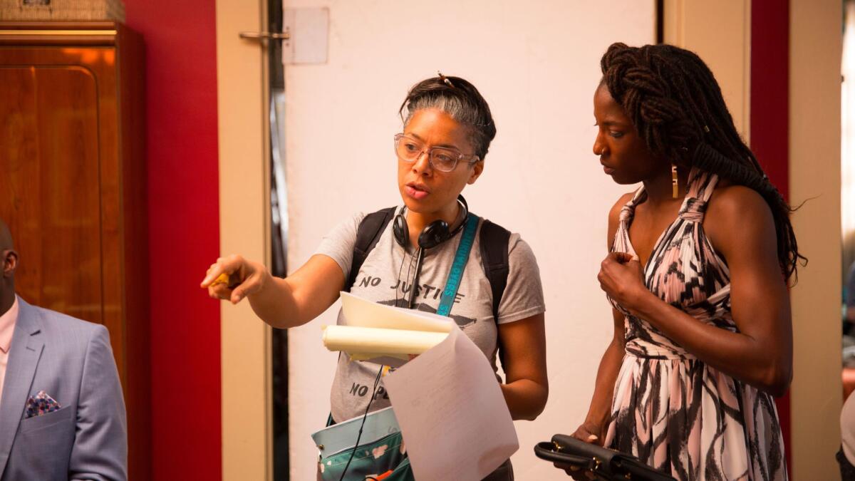 DeMane Davis, left, directs actress Rutina Wesley in an episode of "Queen Sugar," created by Ava DuVernay.