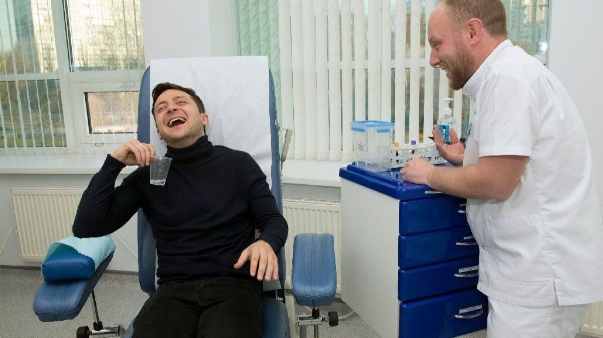 Volodymyr Zelensky, a comedian who won 30% of the vote in the first round of Ukraine's presidential election, laughs as he takes a blood test in Kiev, Ukraine, on Friday.