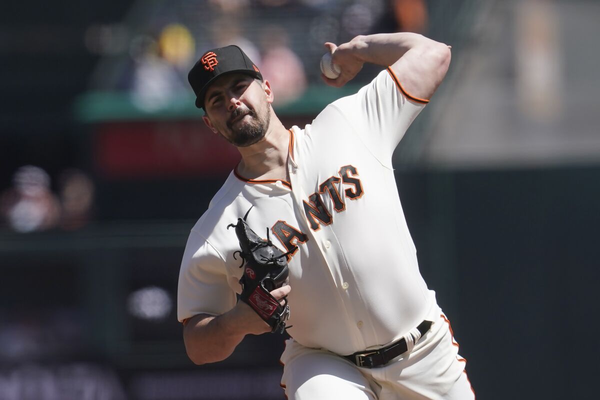 San Francisco Giants' Carlos Rodon pitches against the Miami Marlins during the first inning of a baseball game in San Francisco, Saturday, April 9, 2022. (AP Photo/Jeff Chiu)