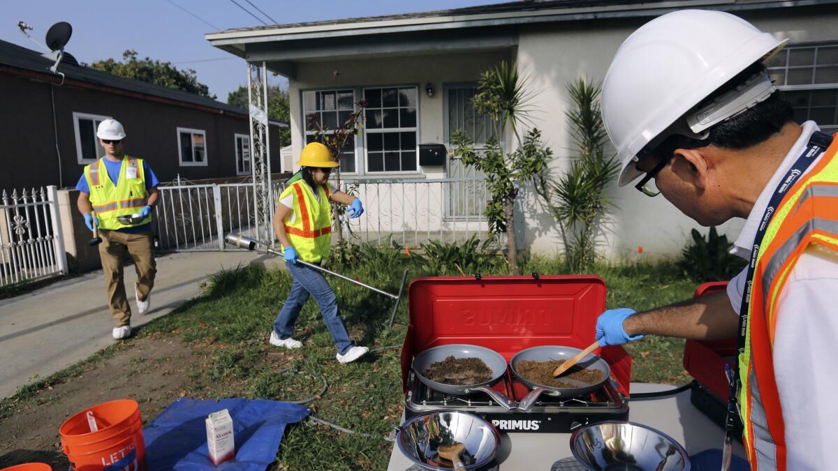 Bharat Dungrani, an environmental health specialist for the L.A. County Health Dept, removes moisture from soil samples collected in Commerce, Calif. on Feb. 29, 2016. The soil was then tested for possible lead contamination from the nearby and now closed Exide battery plant.