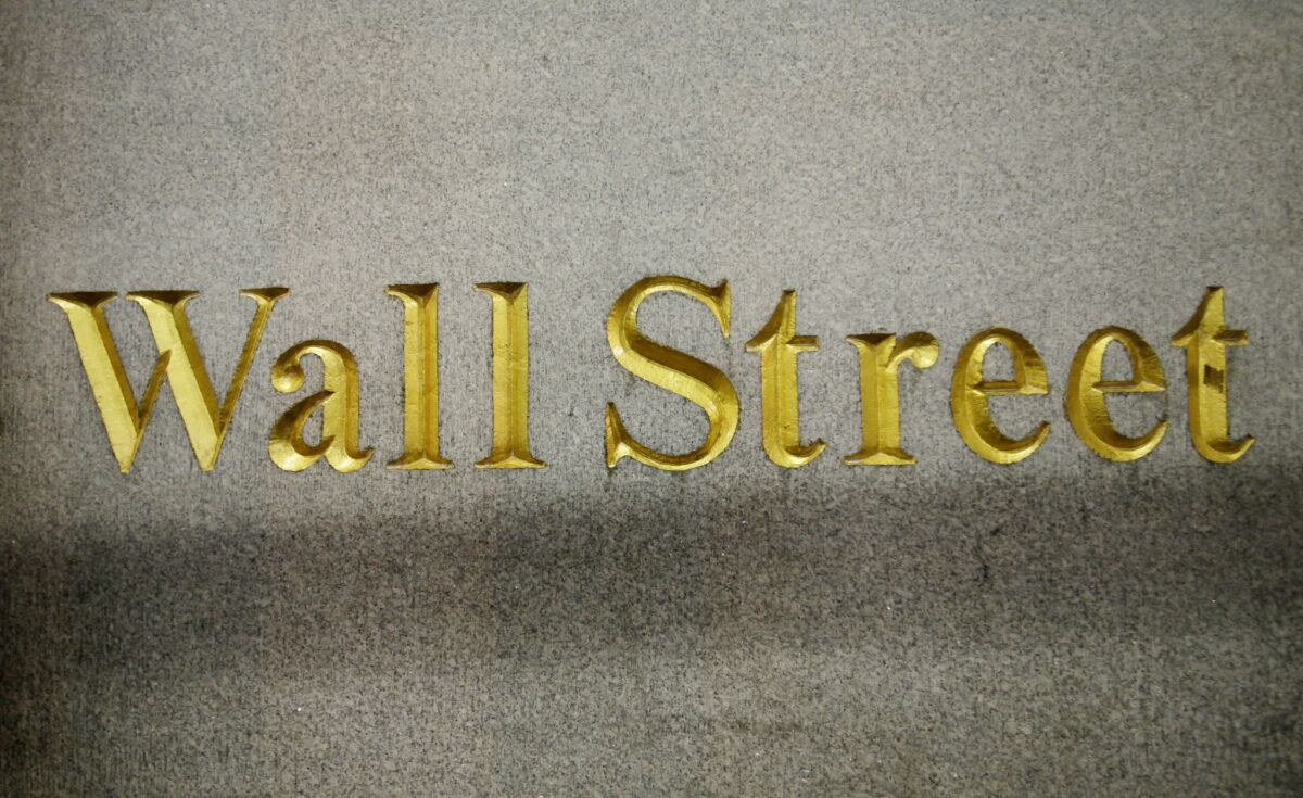 A Wall Street address on the side of a building.