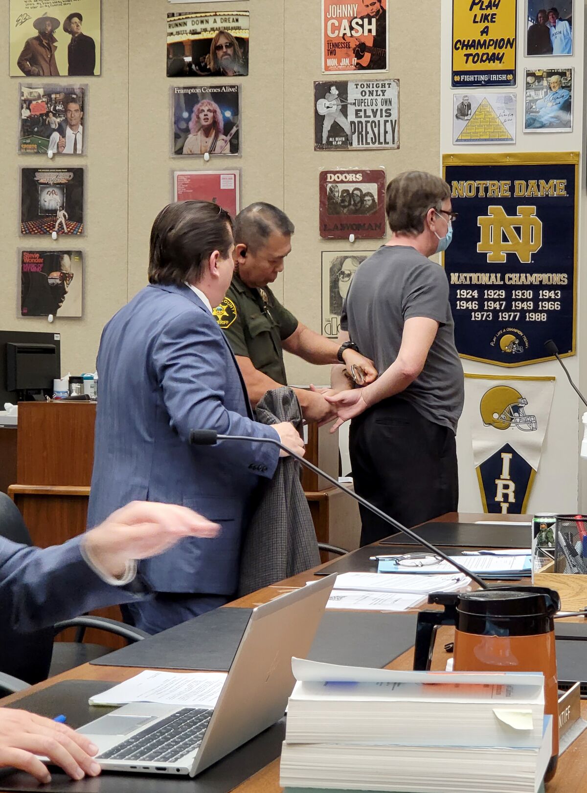 A deputy handcuffs Dr. David Lee Haller, 55, immediately after his sentencing hearing on Oct. 14.