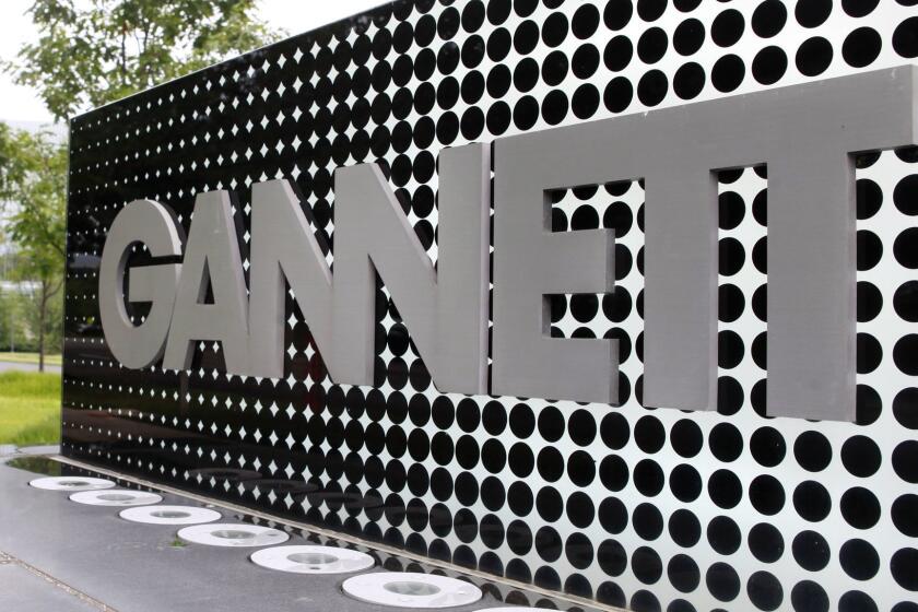 FILE - In this July 14, 2010, file photo, the Gannett Co.headquarters sign stands in McLean, Va. The Wall Street Journal is reporting that MNG Enterprises, better known as Digital First Media, is preparing to bid for newspaper publisher Gannett Co. (AP Photo/Jacquelyn Martin, File)