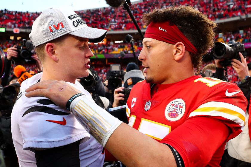 Joe Burrow of the Bengals hugs Patrick Mahomes  of the Chiefs after the AFC Championship Game in 2022