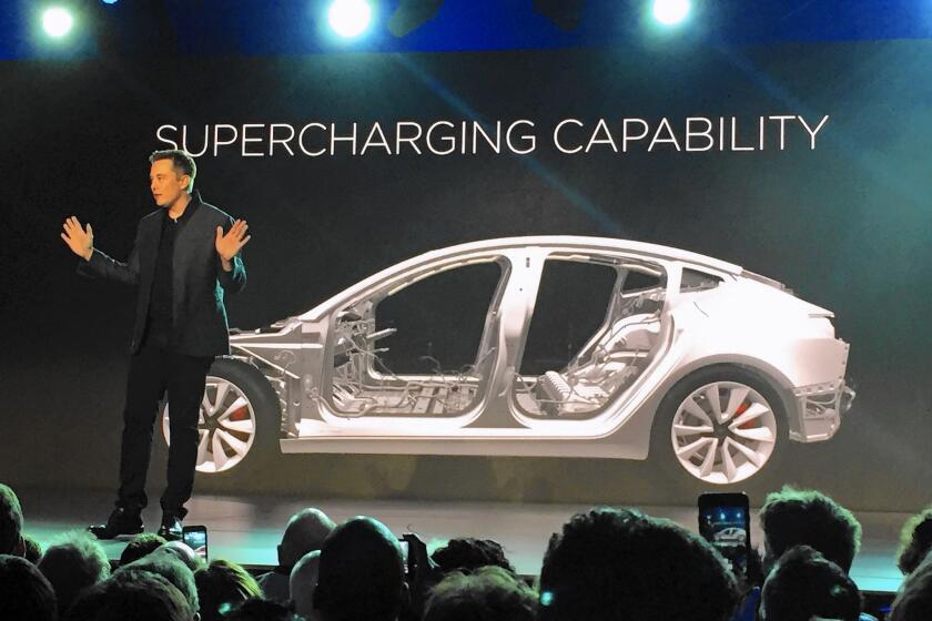 Tesla Chief Executive Elon Musk speaks at the unveiling Thursday night in Hawthorne