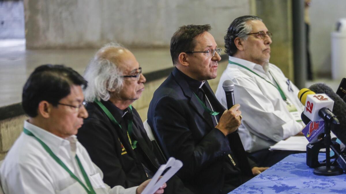 Papal nuncio Waldemar Sommertag answers questions at a news conference in February with Cardinal Leopoldo Brenes (second from left), archbishop of Managua.