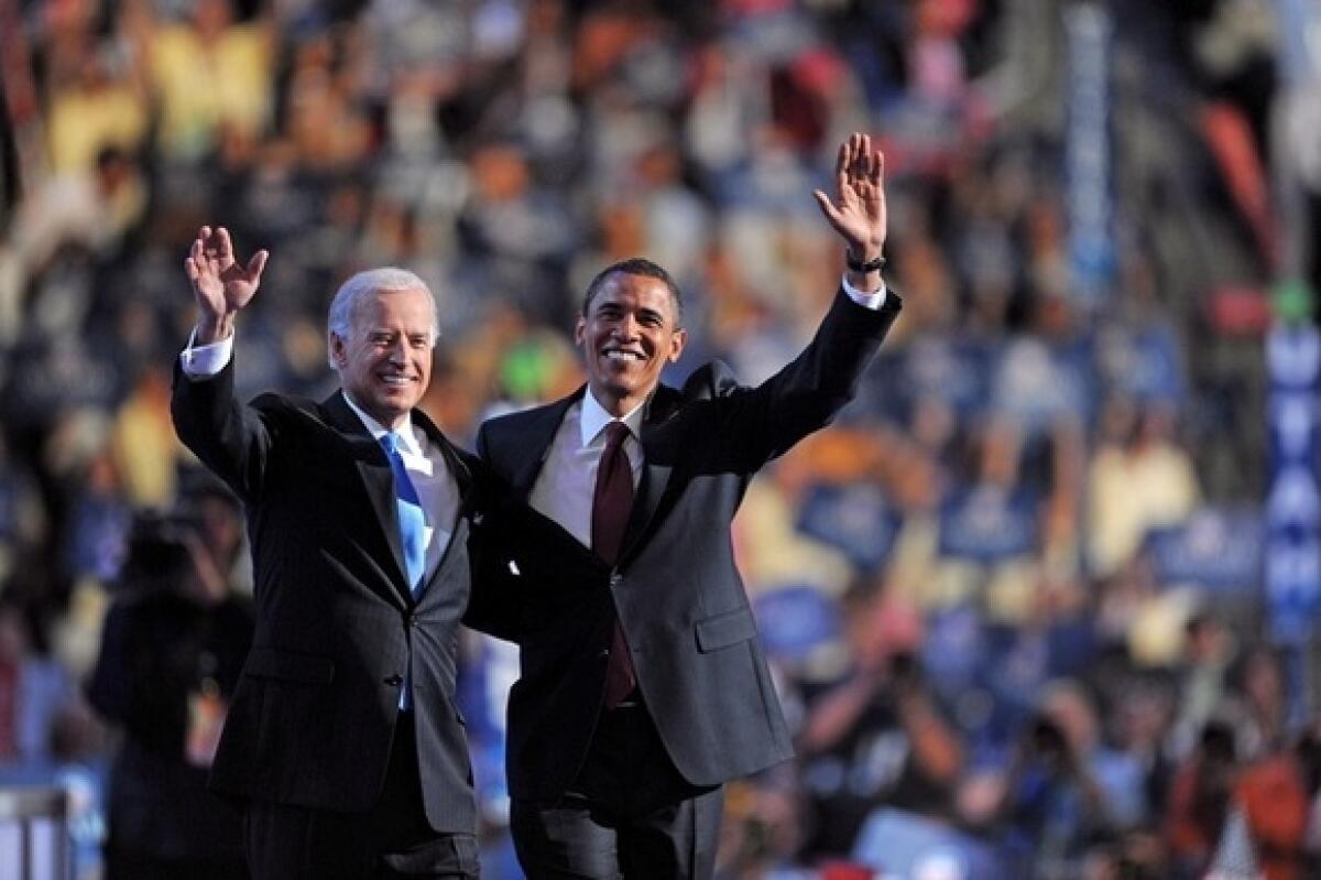 Then-Sens. Barack Obama and Joe Biden wave to the crowd at the 2008 Democratic National Convention at the Pepsi Center in Denver.