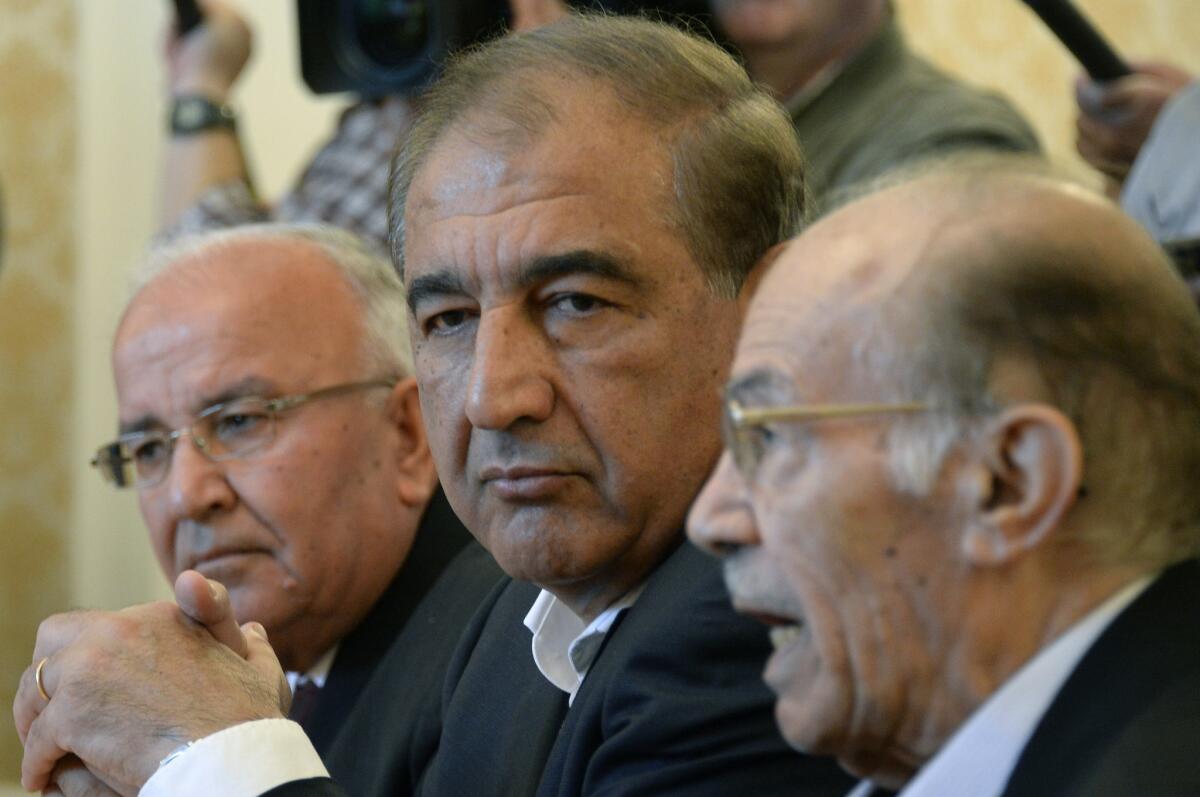 Syria's former deputy prime minister, Qadri Jamil, center, and other members of the Syrian opposition attend a meeting with Russian Foreign Minister Sergei Lavrov in Moscow on Aug. 31, 2015.