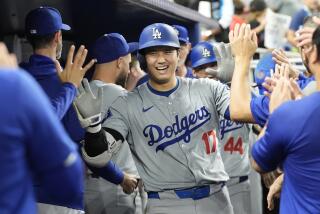 Los Angeles Dodgers' Shohei Ohtani (17) celebrates after hitting a home run during the sixth.