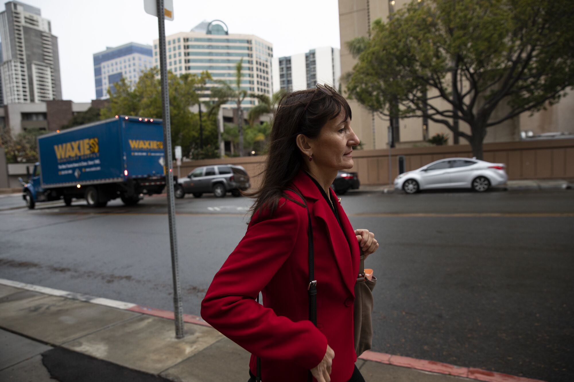 Olga Ponomareva walks to immigration court after parking