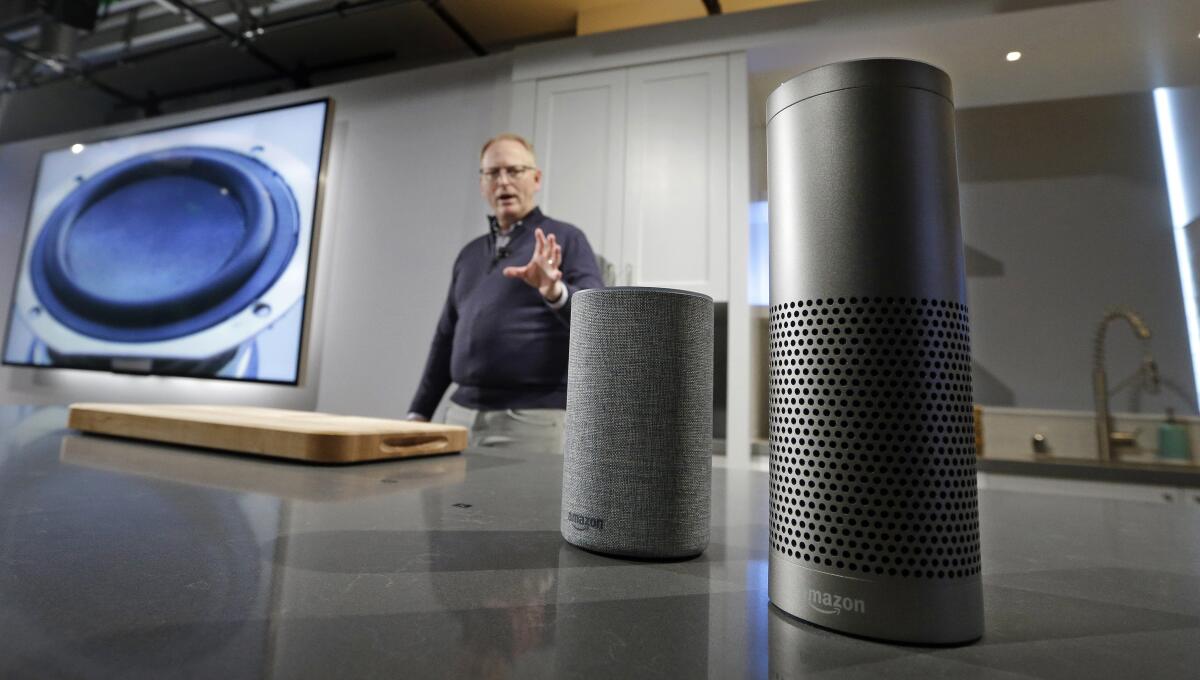 Amazon executive David Limp with an Echo and Echo Plus