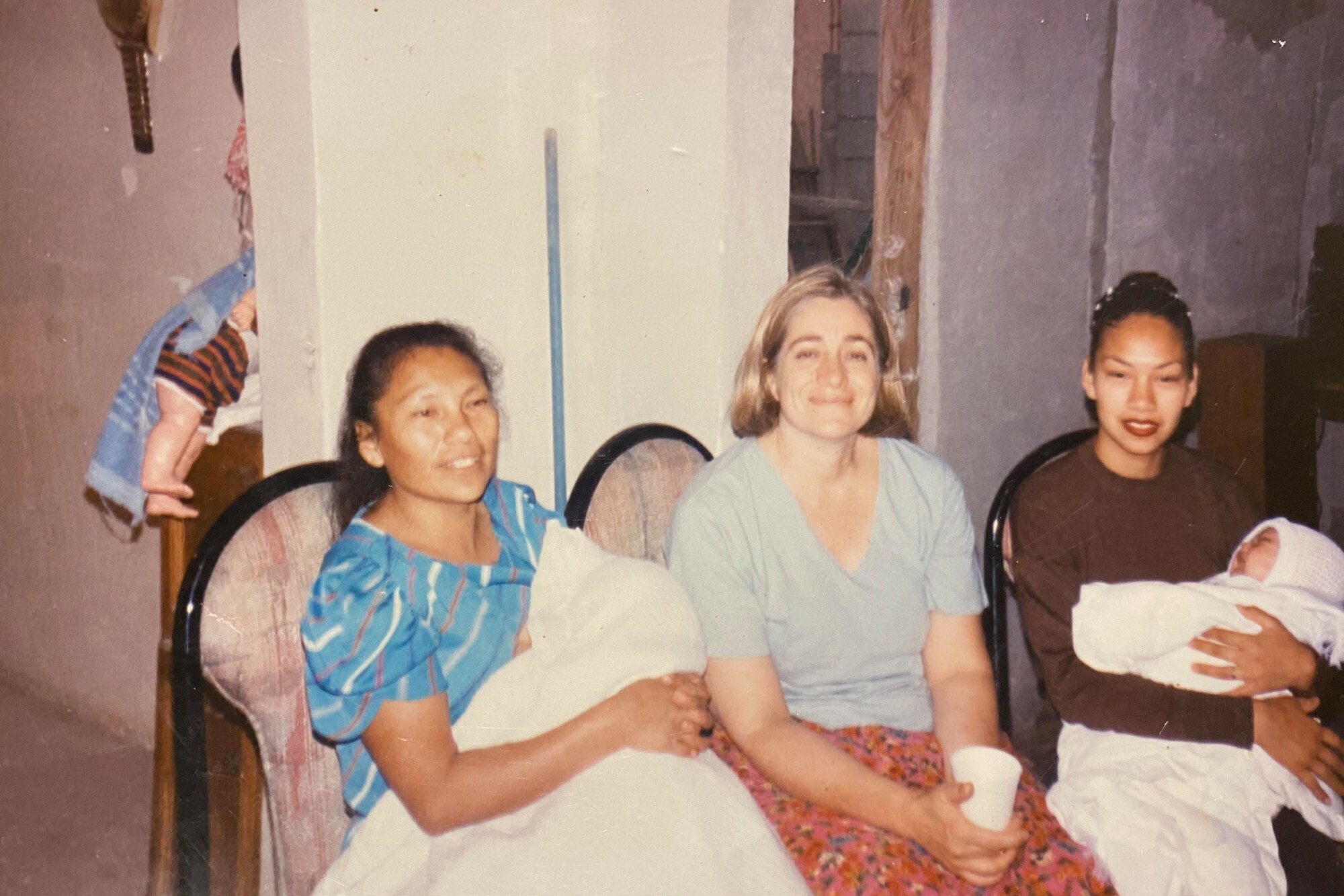 Angela Rangel, Sandra Dibble and Teresa Rangel with two babies at Angela's home in Tijuana.