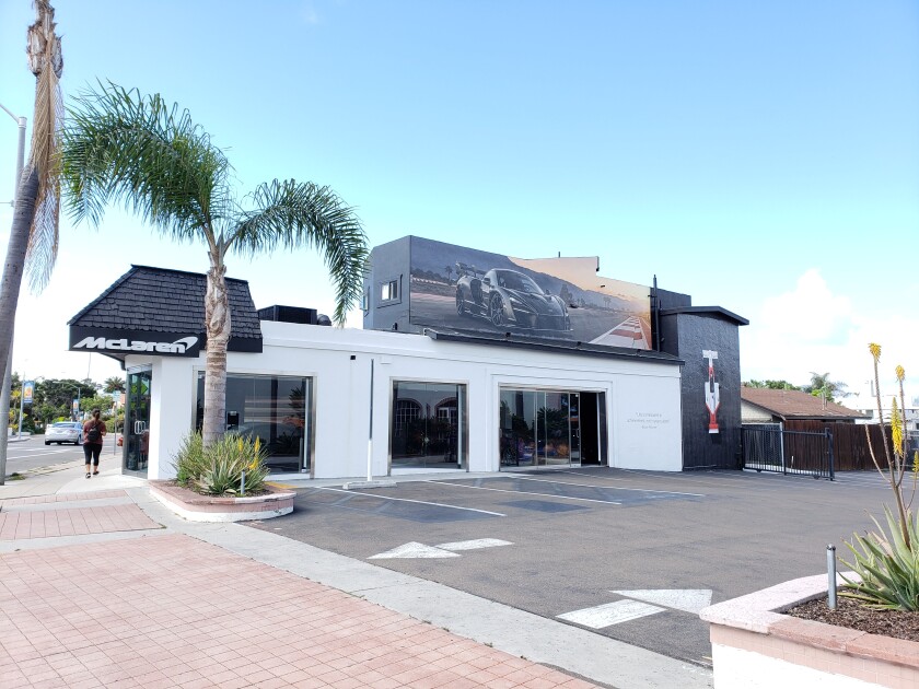 A marquee depicting a McLaren car over a McLaren dealership at 7440 La Jolla Blvd. is one of four 'murals' deemed to be 'signs.'