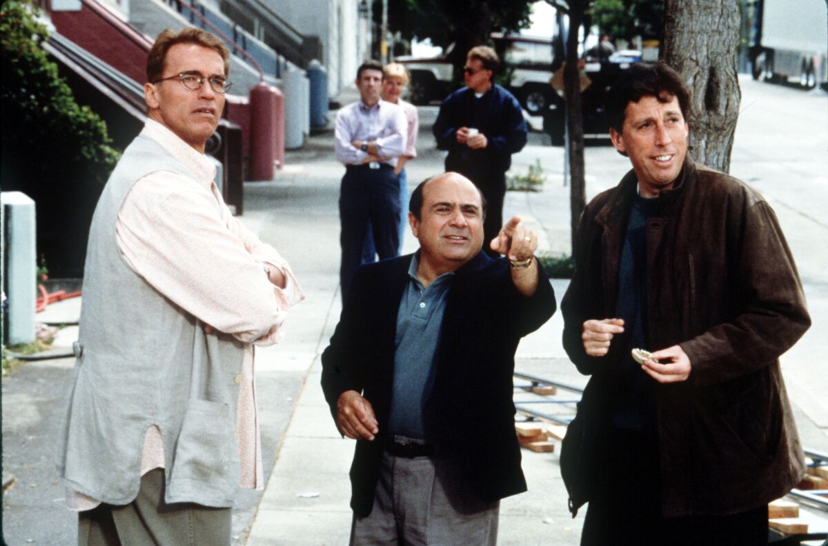 Arnold Schwarzenegger, left, with Danny DeVito and Ivan Reitman on the set of "Junior."