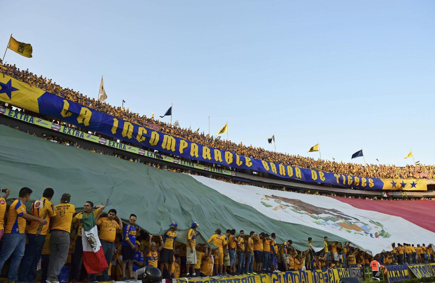 Fans of Mexico's Tigre cheer for their team before the start of their Copa Libertadores first leg final against Argentina's River Plate at the University stadium in Monterrey, Mexico on July 29, 2015. AFP PHOTO/ RONALDO SCHEMIDTRONALDO SCHEMIDT/AFP/Getty Images ** OUTS - ELSENT, FPG - OUTS * NM, PH, VA if sourced by CT, LA or MoD **