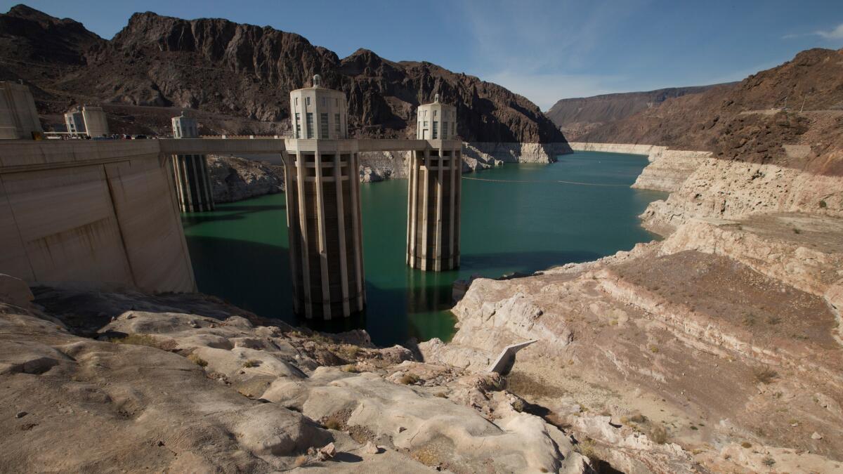 Parts of Hoover Dam are exposed by the low water level of Lake Mead.