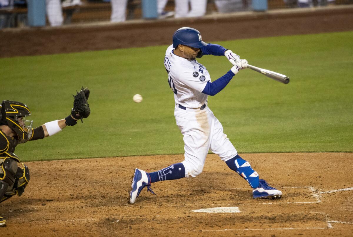 Mookie Betts of the Dodgers strikes out to end a game on April 22 against the Padres.