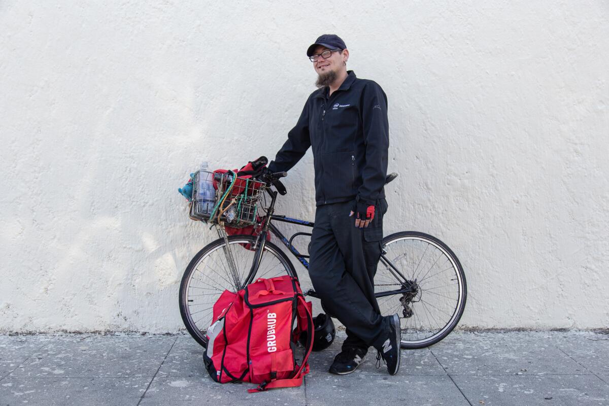 Justin Zemlyansky continues to work as a bike courier for food delivery apps.