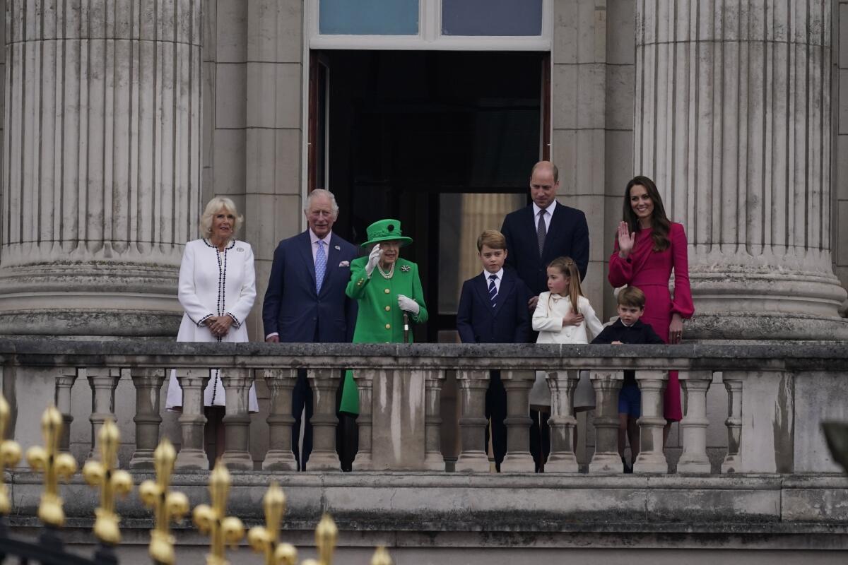 Queen Elizabeth II waves to the crowd during the Platinum Jubilee Pageant outside Buckingham Palace in London on June 5. 