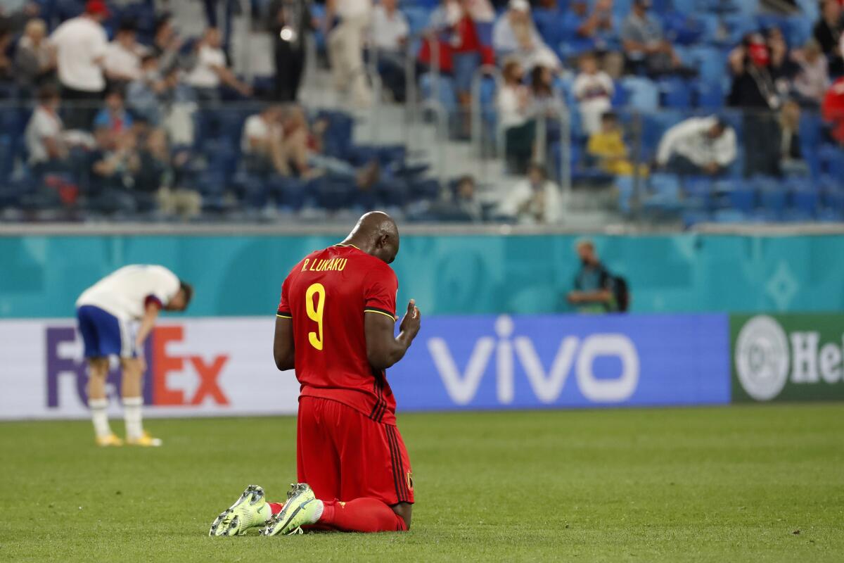 Belgium's Romelu Lukaku knees 